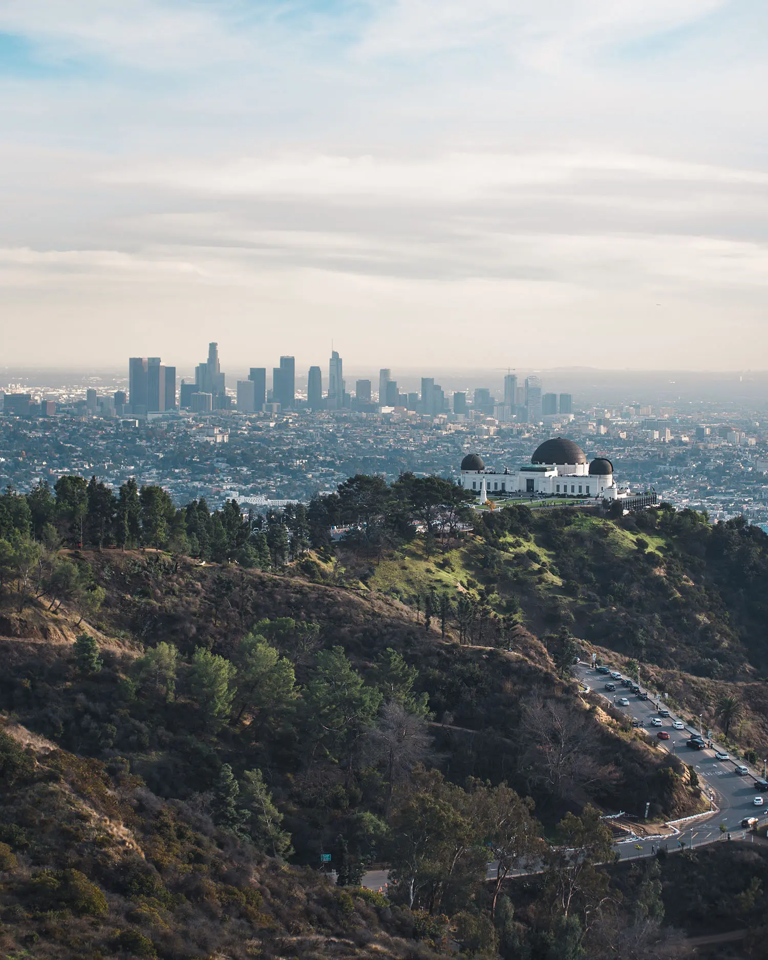 view of Griffith Observatory, with skyline of Los Angeles in background