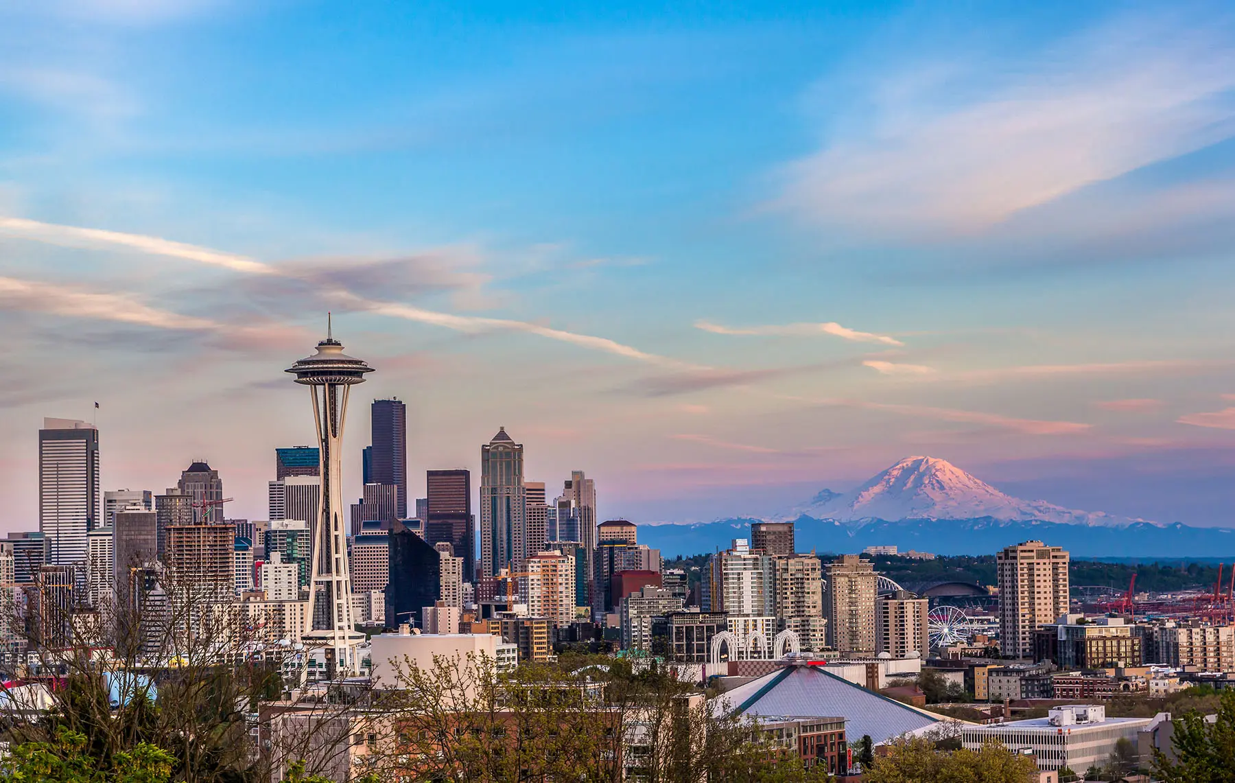 Seattle downtown skyline and Mt. Rainier at sunset.
