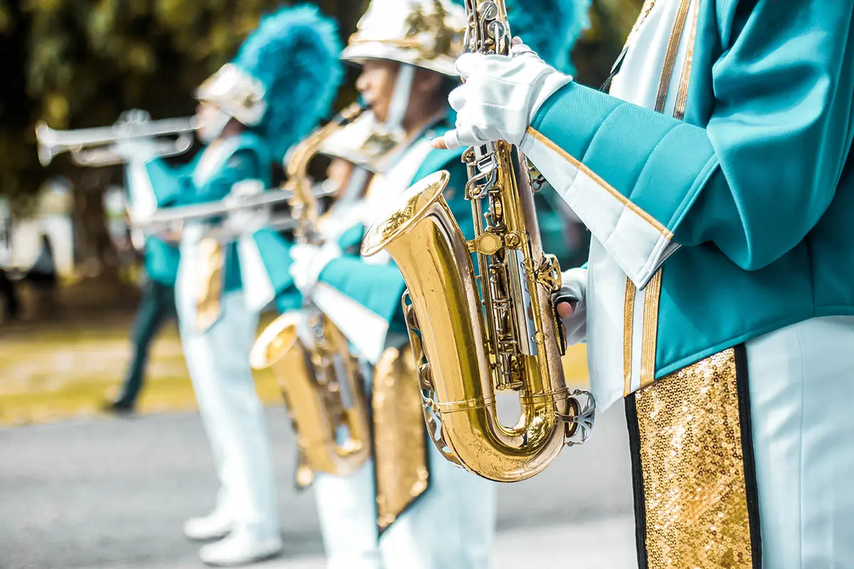 Group of students saxophone, School band performs in marching ba