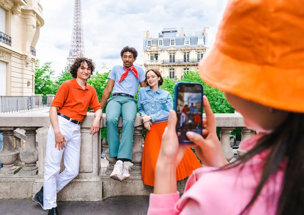 Group of young students visiting Paris and Eiffel Tower