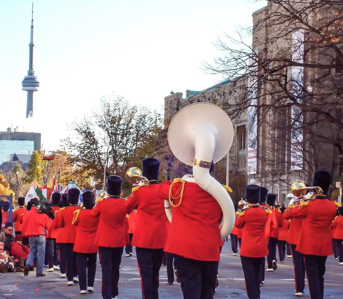 festive street filled with marching band musicians