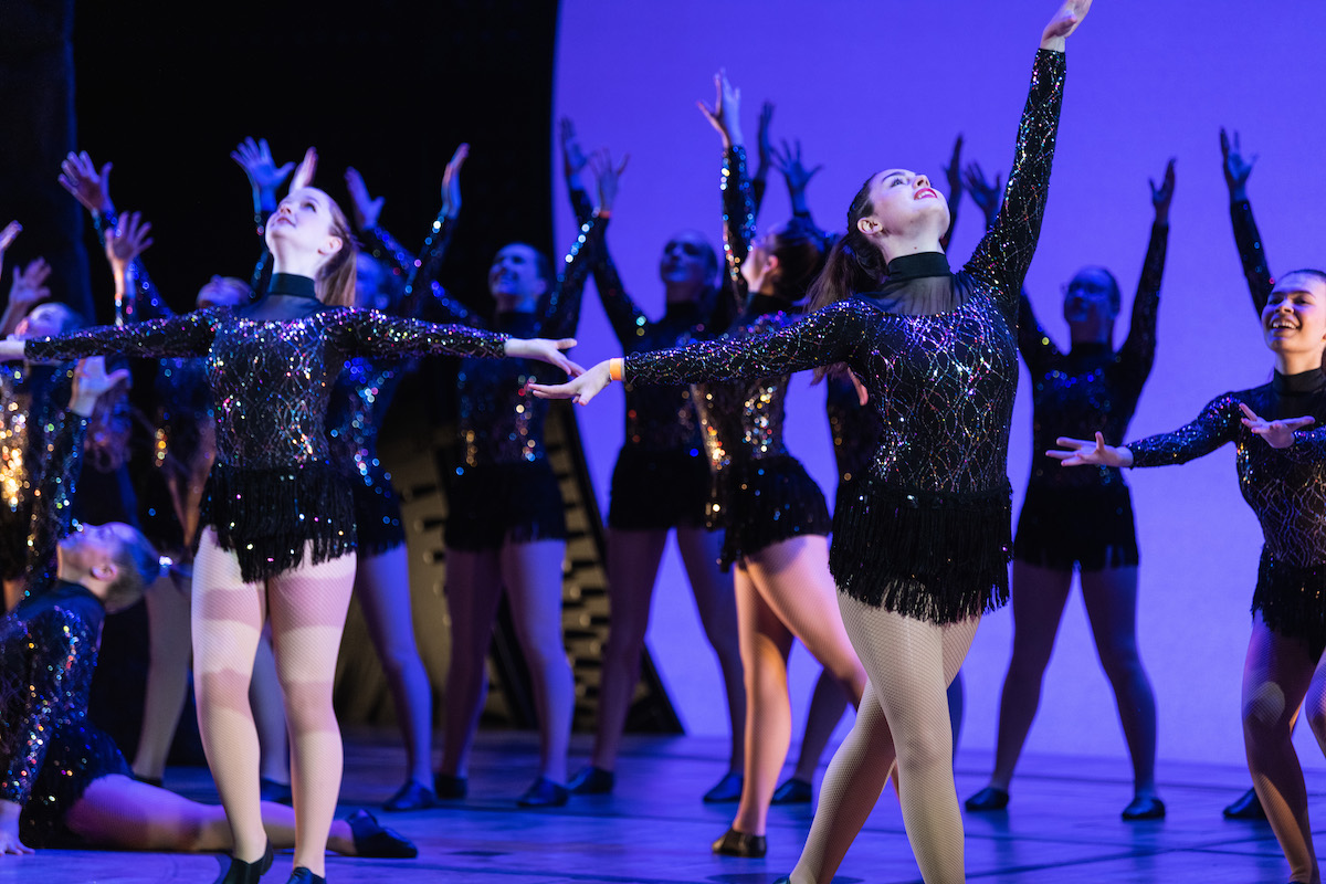 student dance group performing on broadway stage