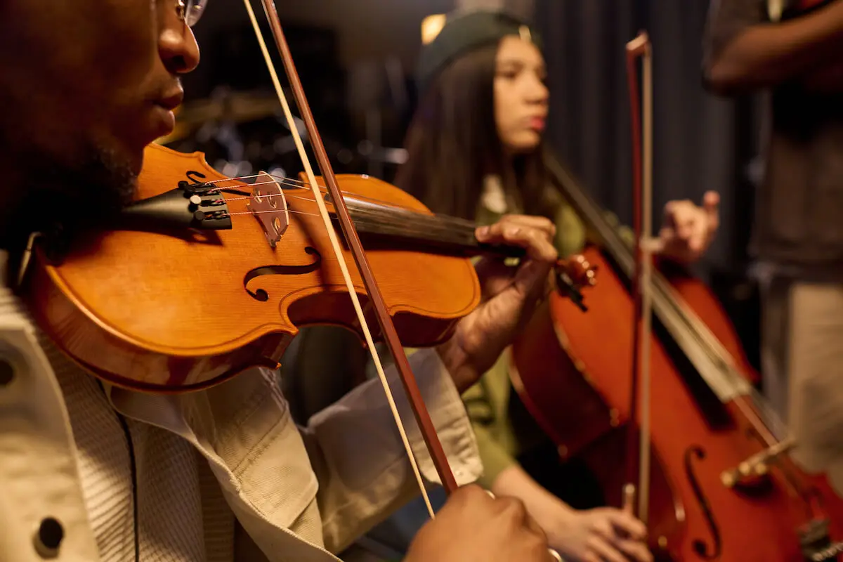 student travelers playing string instruments