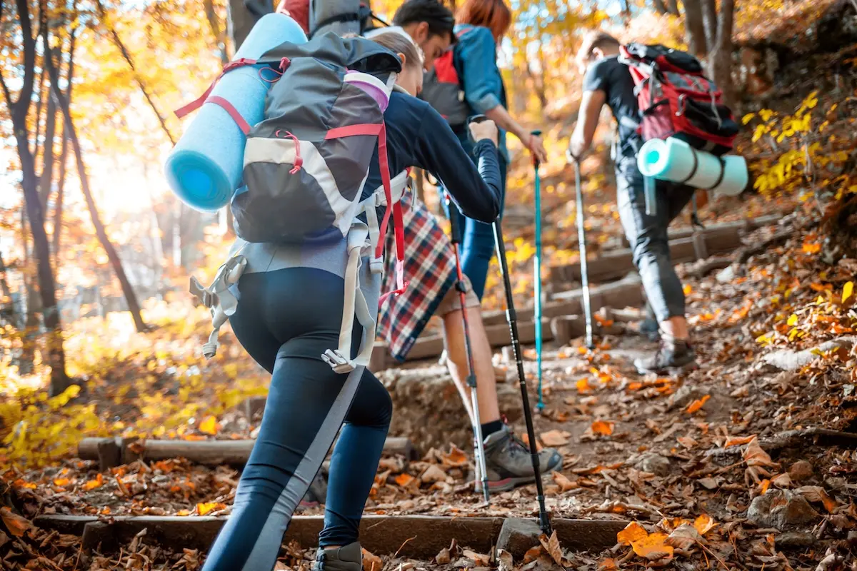 students hiking with backpacks