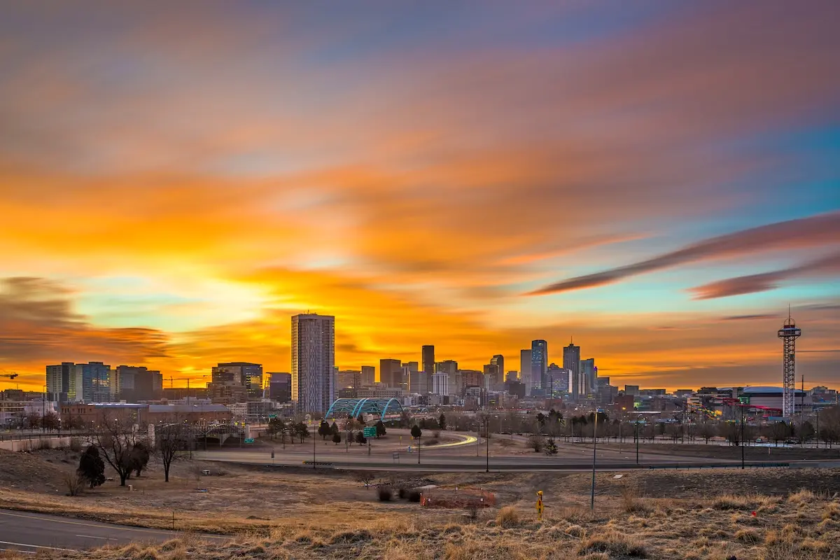 Denver, Colorado, USA downtown city skyline at dawn.