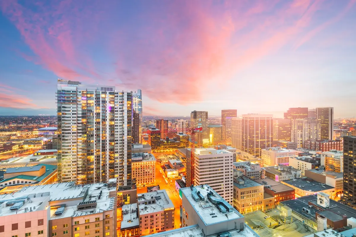 Denver, Colorado, USA downtown cityscape rooftop view at dusk.
